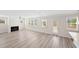 Bright and airy living room with a fireplace, large windows, and a door to the backyard at 1246 Allspice Way, Lawrenceville, GA 30045
