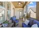 Relaxing covered porch with wicker seating, a table, and a ceiling fan at 260 Hemphill Ln, Marietta, GA 30064
