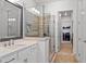 Modern bathroom with glass-enclosed shower and updated sink and cabinets for storage at 260 Hemphill Ln, Marietta, GA 30064