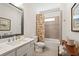 Bathroom featuring a modern vanity, framed mirror, shower and tub combination with colorful curtain at 260 Hemphill Ln, Marietta, GA 30064