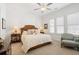 Bright bedroom features a plush bed, comfortable chair, and an abundance of natural light from the windows at 260 Hemphill Ln, Marietta, GA 30064