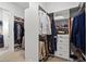 Well-organized closet with shelves and racks provides ample storage for clothes, shoes and accessories at 260 Hemphill Ln, Marietta, GA 30064