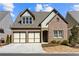 Charming brick home featuring a two-car garage and well-maintained landscaping at 260 Hemphill Ln, Marietta, GA 30064