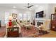 Elegant living room with natural light, plush seating, a fireplace, and sophisticated decor at 260 Hemphill Ln, Marietta, GA 30064