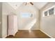 Bright bedroom featuring light-colored walls and hard wood flooring at 8000 Abington Dr, Locust Grove, GA 30248