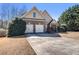 Charming two-story home featuring brick and siding, a two-car garage, and a well-maintained front yard at 8000 Abington Dr, Locust Grove, GA 30248