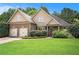Inviting two-story home with manicured lawn and mature trees at 8000 Abington Dr, Locust Grove, GA 30248