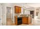 Kitchen area with granite countertops, wood cabinets, and access to the front entry at 8000 Abington Dr, Locust Grove, GA 30248