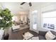 Open living room with hardwood floors, modern lighting and an adjacent dining area and sitting room at 1121 Larkin Dr # 50, Buford, GA 30518