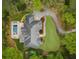 Aerial view of estate featuring a swimming pool, lush landscaping, and circular driveway at 581 Fairfield Nw Rd, Atlanta, GA 30327