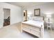 A naturally lit bedroom with an adjacent bathroom at 581 Fairfield Nw Rd, Atlanta, GA 30327