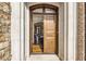 Elegant entryway with a solid wood door and stone surround at 581 Fairfield Nw Rd, Atlanta, GA 30327
