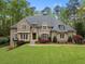 Stunning brick home with a meticulously manicured lawn and elegant landscaping at 581 Fairfield Nw Rd, Atlanta, GA 30327