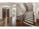 Grand foyer with hardwood floors, staircase, and views into the living spaces at 581 Fairfield Nw Rd, Atlanta, GA 30327