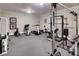 Well-equipped home gym with a variety of exercise machines and weights, perfect for fitness enthusiasts at 581 Fairfield Nw Rd, Atlanta, GA 30327