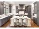Bright, stylish kitchen with gray cabinets, a center island, and marble countertops at 581 Fairfield Nw Rd, Atlanta, GA 30327