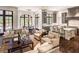 Open-concept living room with a modern kitchen, dining area, and comfortable seating at 581 Fairfield Nw Rd, Atlanta, GA 30327