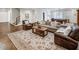 A living room featuring a billiards table, hardwood floors, and a cozy seating area with a large rug at 581 Fairfield Nw Rd, Atlanta, GA 30327