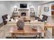 Cozy living room featuring a stone fireplace, dark wood floors, and comfortable seating arrangements at 581 Fairfield Nw Rd, Atlanta, GA 30327