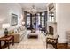 Cozy living room with a stone fireplace, large windows, and stylish decor at 581 Fairfield Nw Rd, Atlanta, GA 30327