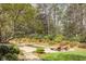 Secluded backyard pool with well-manicured landscaping and mature trees at 581 Fairfield Nw Rd, Atlanta, GA 30327