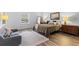Bright bedroom with a seating area, natural light, and classic furnishings at 9635 Loblolly Ln, Roswell, GA 30075