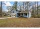 Two-story home with a driveway and attached two-car garage with a blue exterior at 9635 Loblolly Ln, Roswell, GA 30075