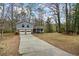 Two-story home with a driveway and attached two-car garage with a blue exterior at 9635 Loblolly Ln, Roswell, GA 30075