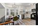 Bright kitchen with white cabinets, stainless steel appliances, and a cozy eat-in area at 9635 Loblolly Ln, Roswell, GA 30075