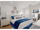 Bright bedroom with light-colored walls, a queen-sized bed, and a sliding glass door to a balcony at 201 New St # 2207-1, Decatur, GA 30030