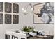 Elegant dining area with a stylish chandelier, sleek table setting, and art at 201 New St # 2207-1, Decatur, GA 30030