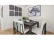 Modern dining room with stylish decor, a sleek table setting, and unique wall art at 201 New St # 2207-1, Decatur, GA 30030