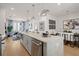 Open kitchen and dining area with island, stainless steel appliances, and contemporary decor at 201 New St # 2207-1, Decatur, GA 30030