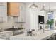 Modern kitchen featuring stainless steel appliances, white cabinets, and granite countertops at 201 New St # 2207-1, Decatur, GA 30030