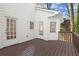 Cozy back deck area with freshly painted siding and wood floorboards at 3189 Saddleback Mountain Rd, Marietta, GA 30062