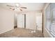 This spacious bedroom includes a ceiling fan, carpet, and a private bathroom at 3759 Rosemary Se Ln, Conyers, GA 30013