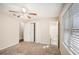 Cozy bedroom featuring neutral walls, carpet, and a window view at 3759 Rosemary Se Ln, Conyers, GA 30013