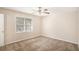 Bedroom featuring neutral walls, plush carpeting, and a window offering natural light at 3759 Rosemary Se Ln, Conyers, GA 30013