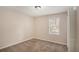 Bedroom featuring neutral walls, plush carpeting, and a window offering natural light at 3759 Rosemary Se Ln, Conyers, GA 30013