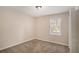 A cozy bedroom with neutral carpeting and a window that lets in plenty of natural light at 3759 Rosemary Se Ln, Conyers, GA 30013