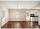 The spacious dining room features hardwood floors, natural light, and a classic chandelier at 3759 Rosemary Se Ln, Conyers, GA 30013