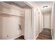 Hallway with laundry hook ups and wooden floors at 3759 Rosemary Se Ln, Conyers, GA 30013