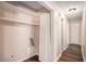 Laundry room featuring an open closet, hardwood floors, and a utility sink at 3759 Rosemary Se Ln, Conyers, GA 30013