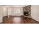 Living room features a stone fireplace and hardwood floors at 3759 Rosemary Se Ln, Conyers, GA 30013