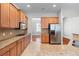 Spacious kitchen featuring stainless steel appliances, granite countertops, and abundant cabinet space for all your culinary needs at 407 Highgate Place, Lawrenceville, GA 30046