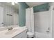 Bright bathroom featuring an integrated shower and tub, plus a stylish, patterned wall at 4178 Glenaire Nw Way, Acworth, GA 30101