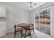 Bright dining area features a round table, a sliding glass door to the backyard, and a stylish rug at 4178 Glenaire Nw Way, Acworth, GA 30101