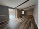 A modern living room with an open floor plan and hardwood floors at 5559 John Burruss Rd, Cumming, GA 30040