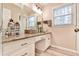 Bathroom featuring large mirror and granite vanity top at 1830 Greystone Ct, Marietta, GA 30068