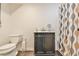 Traditional-style bathroom featuring a dark vanity and patterned shower curtain at 1830 Greystone Ct, Marietta, GA 30068